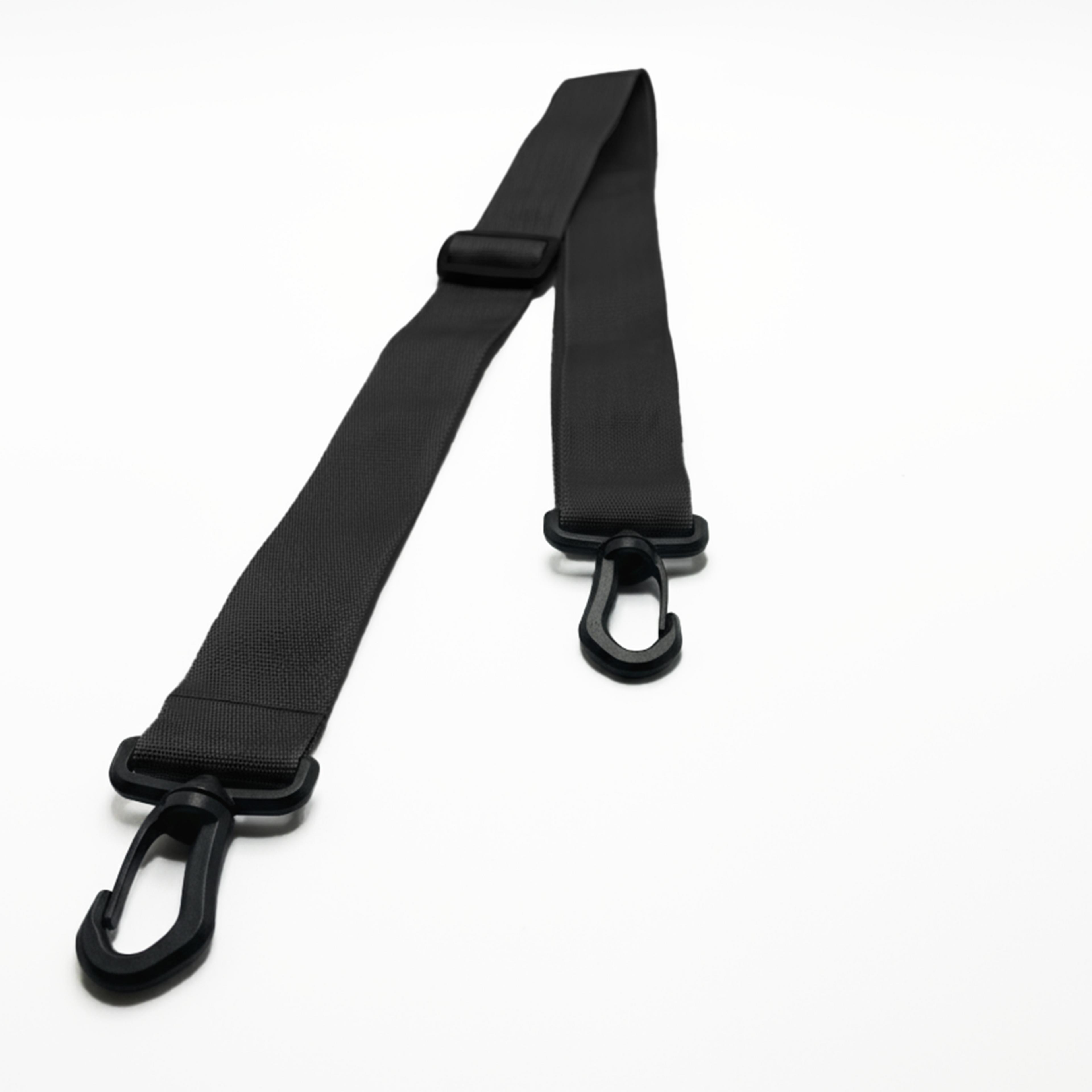 Detachable and adjustable black crossbody strap with quick-release clips for a gym bag.