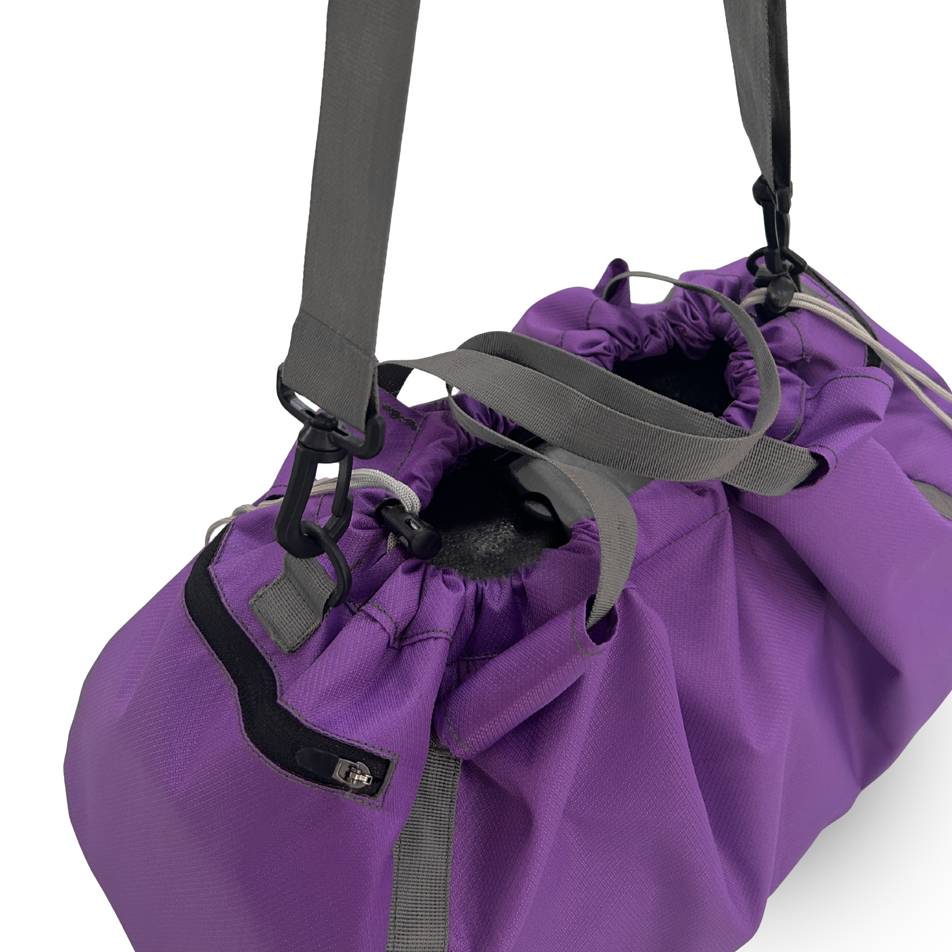 Close-up of a purple nylon gym bag, showing the drawstring opening and side zippered pocket.