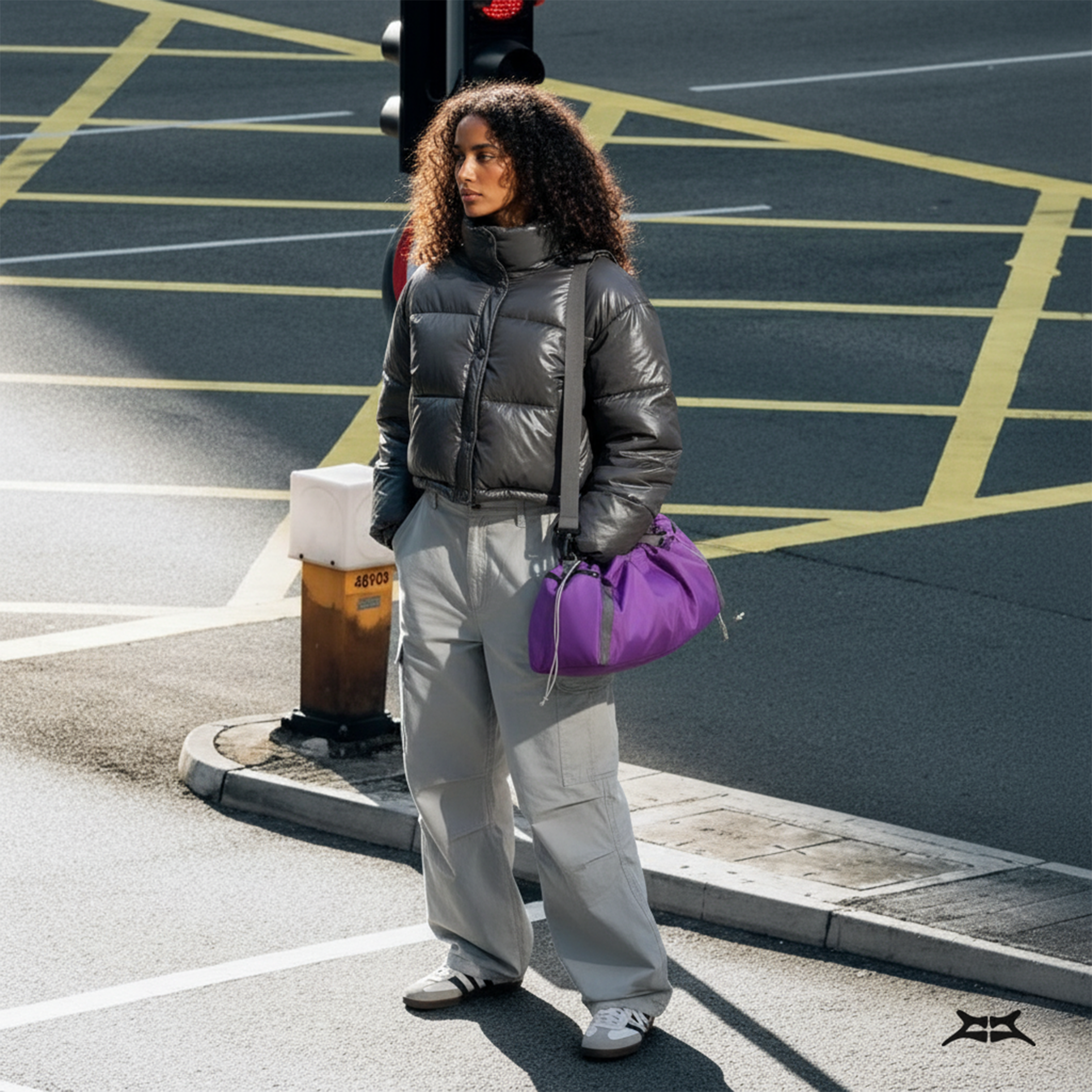 Woman in streetwear fashion, carrying a purple nylon crossbody gym bag.