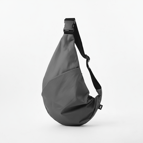 Grey crescent crossbody bag with an adjustable strap and quick release buckle.