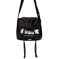 Black drawstring crossbody bag with a white streetwear graphic print.